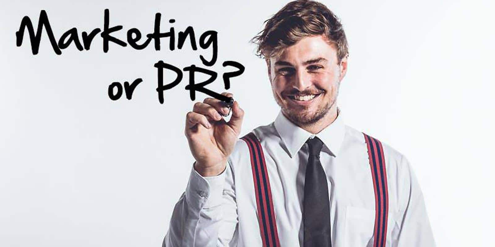 Man writing the words Marketing or PR