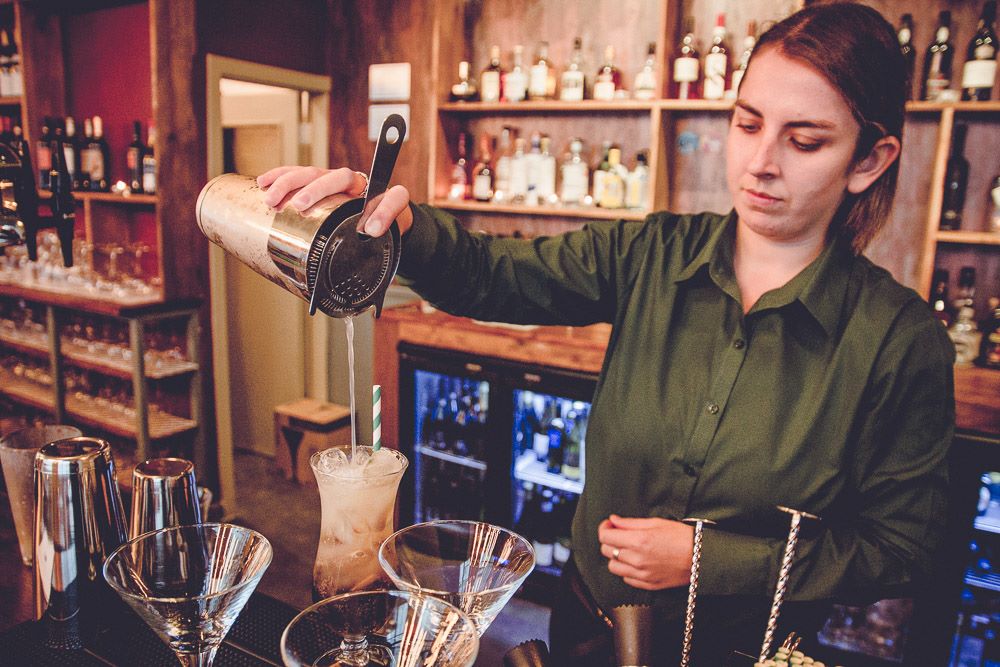 Sheldons Wine Bar Colwyn Bay - bar staff making a cocktail